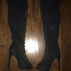 Thigh high lace up boots
